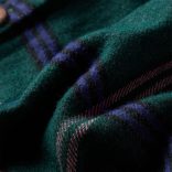 Sötétzöld hosszú ujjú gyerekruha fodrokkal 128