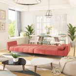 kétszemélyes rózsaszín bársony kanapéágy két párnával