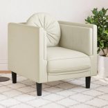 krémszínű bársony kanapéfotel párnával