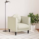 krémszínű bársony kanapéfotel párnával