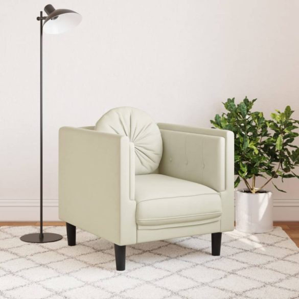 krémszínű bársony kanapéfotel párnával