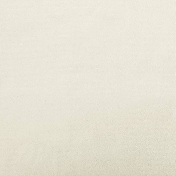 krémszínű bársony kanapéfotel párnával