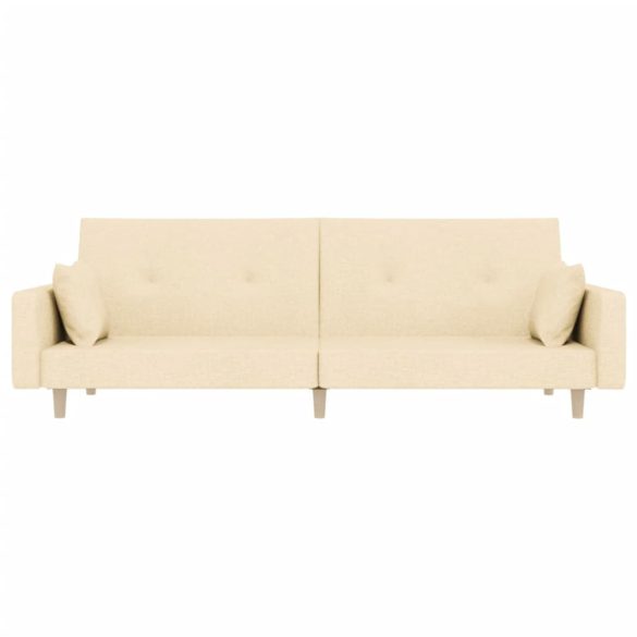 kétszemélyes krémszínű szövet kanapéágy két párnával