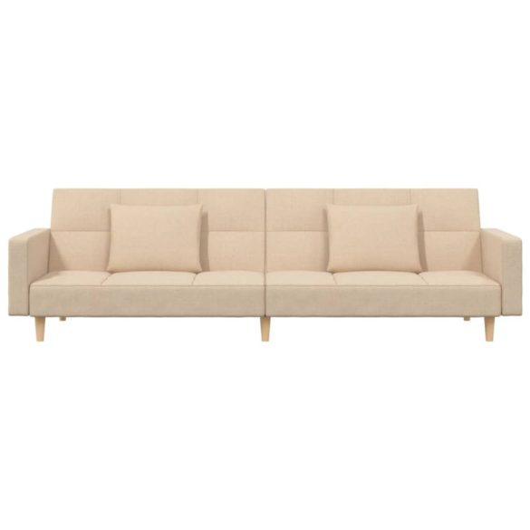 kétszemélyes krémszínű szövet kanapéágy két párnával