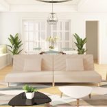 kétszemélyes krémszínű szövet kanapéágy két párnával